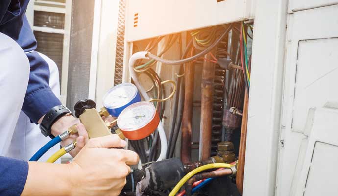 An expert repairing AC