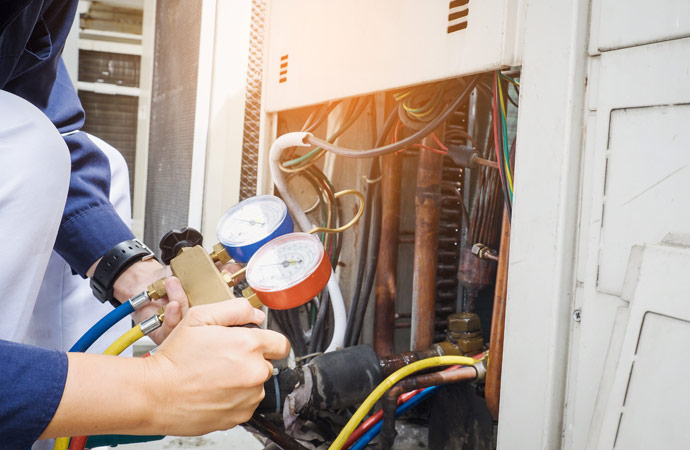 a professional worker checking ac gas