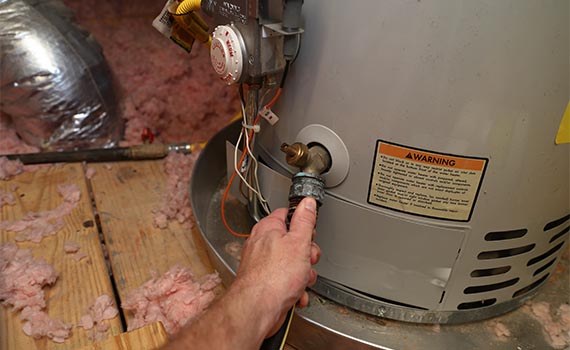 Professional repairing a water heater