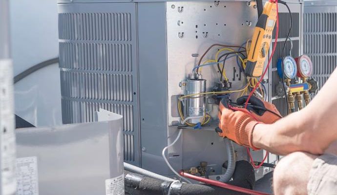 Technician examine heat load of your ac unit