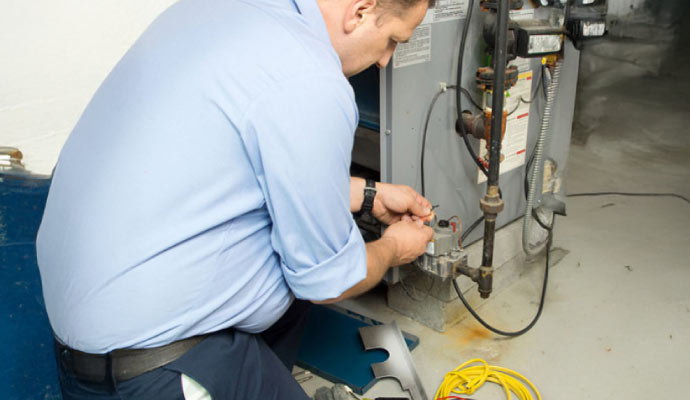 Professional worker installing heating system